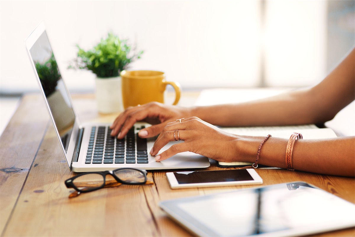 Website - Female typing on a laptop computer - Apostille Nation